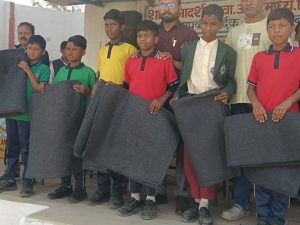 Tathagata Foundation distributed blankets to tribal families and school dresses to children.