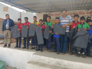 Tathagata Foundation distributed blankets to tribal families and school dresses to children.