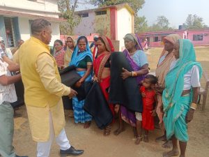 Tathagata Foundation distributed blankets to tribal families and school dresses to children.